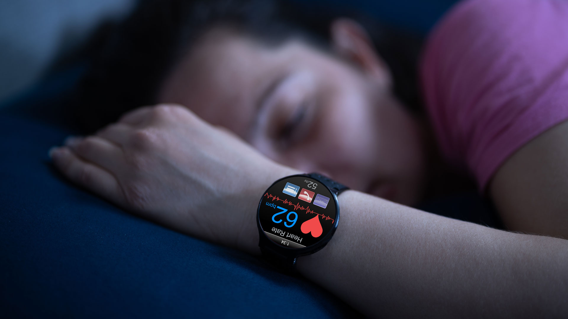 a person sleeping while wearing a smartwatch.